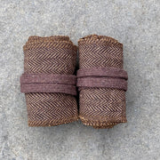 Brown Herringbone wool arm wraps for LARP and reenactment. Keep sleeves secure, add warmth, and prevent scratches. Easy to wear with secure straps.